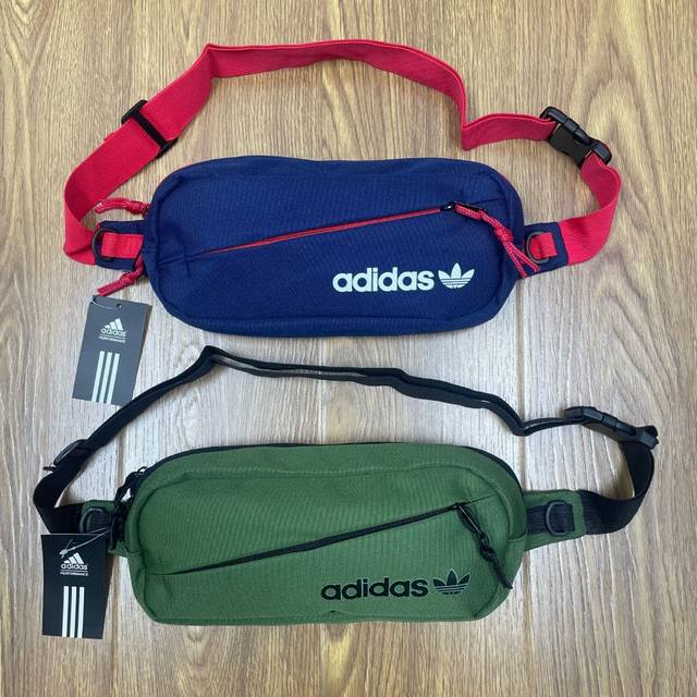 Adidas阿迪达斯三叶草高品质多功能运动休闲腰包手提包单肩包斜挎包 颜色：军绿色 深蓝色 尺寸：31X14X6 Cm